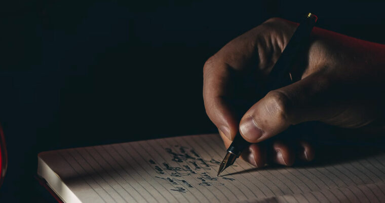 Hand som skriver